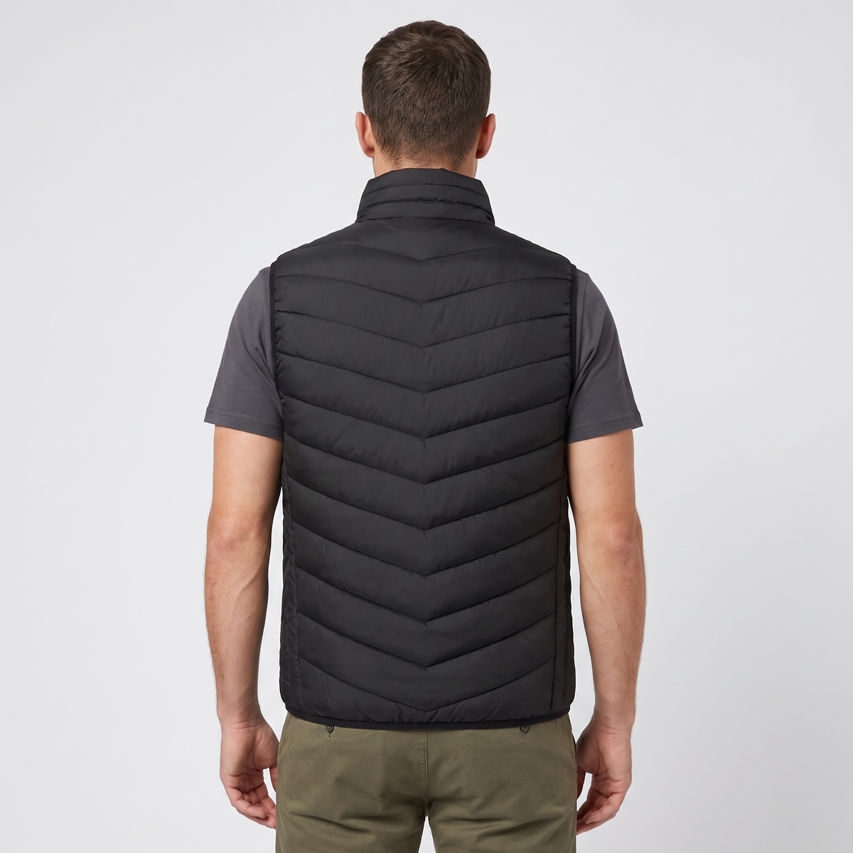 Back view of a man wearing the Terrabound men's padded gilet