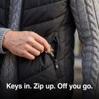 Close-up of keys going into the zipped hand pocket of the Terrabound men's padded gilet