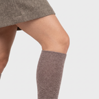 Knee high sock cuff sitting flat just below the knee