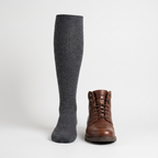 Knee high sock beside a walking boot to show the height