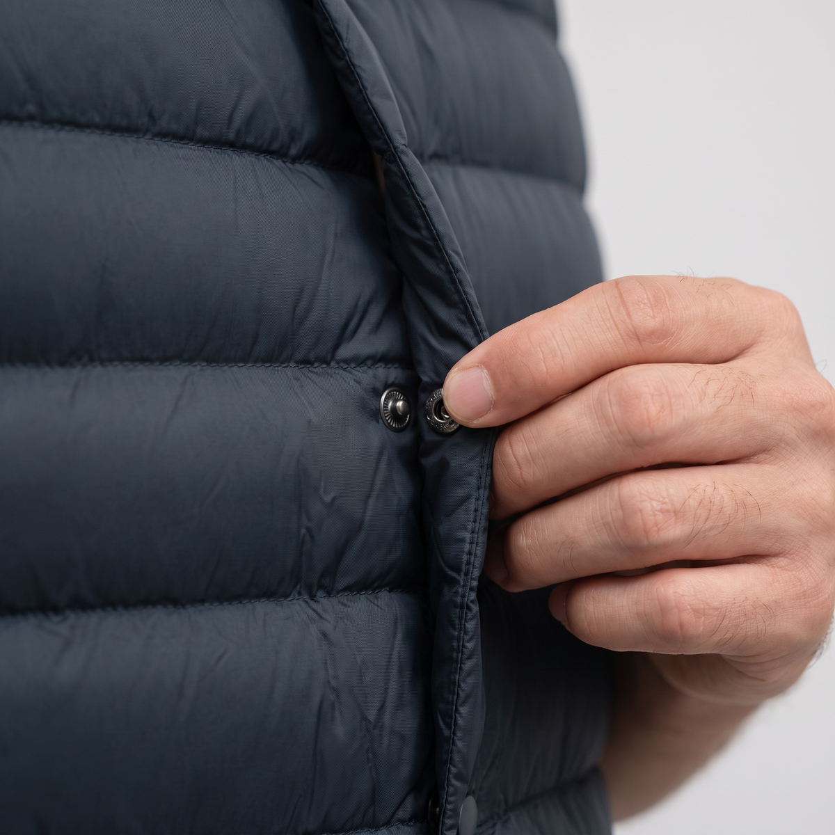 Close-up of the snap-stud placket and baffle quilting on the Terrabound down gilet
