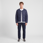 Terrabound Men's Puffer Jacket in Navy, full-length view with jeans and trail shoes