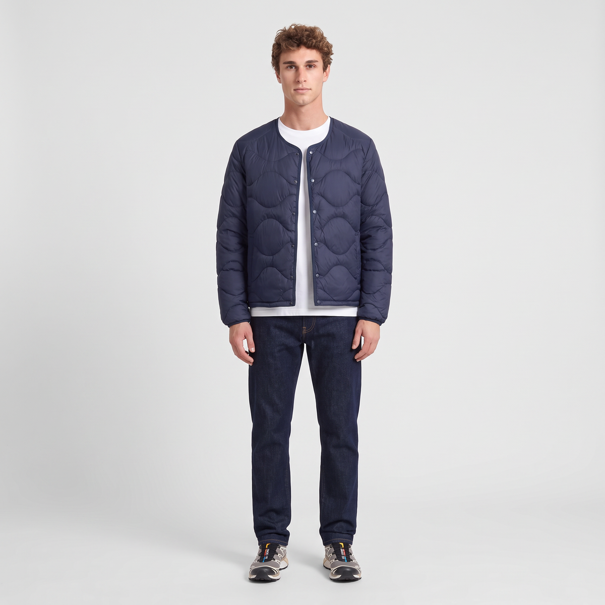 Terrabound Men's Puffer Jacket in Navy, full-length view with jeans and trail shoes