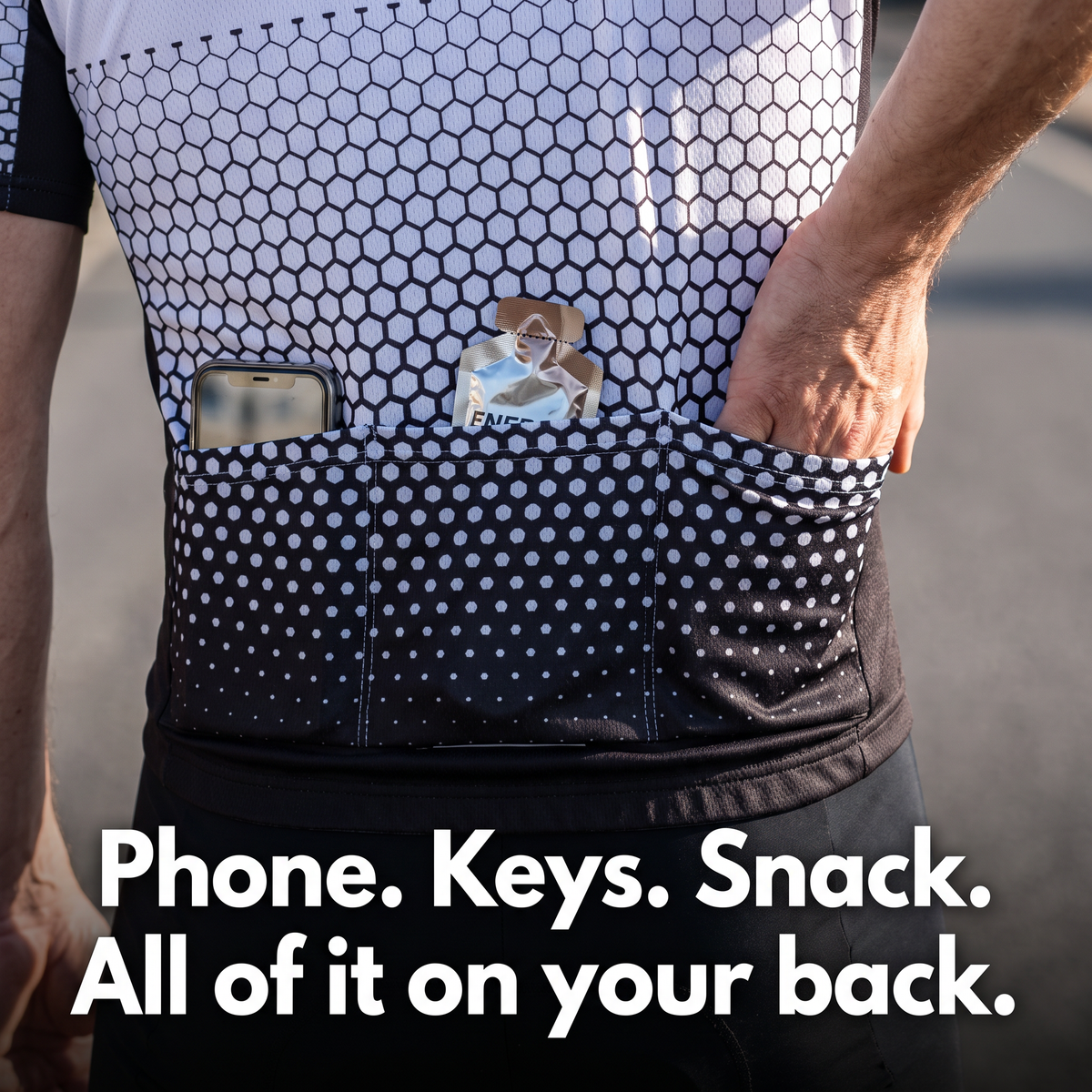 Three rear pockets loaded with a phone and an energy gel while riding