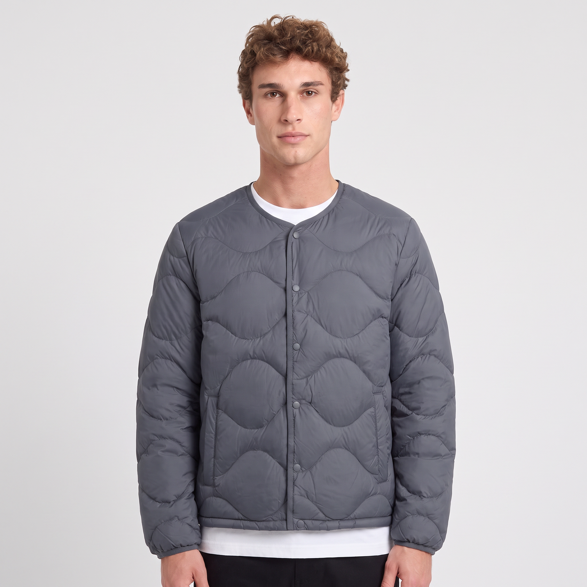 Terrabound Men's Puffer Jacket in Charcoal, collarless quilted down jacket, worn front view
