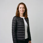 Women's Puffer Jacket in Black, three-quarter side view