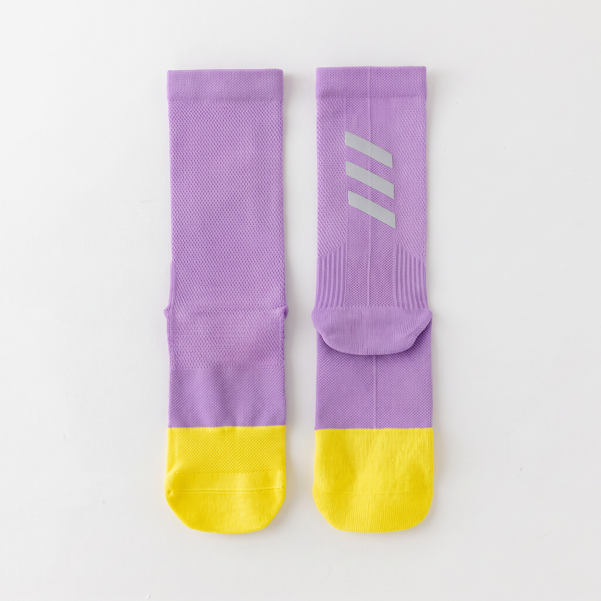 Cycling socks in Reflective Purple, purple leg with a yellow foot
