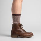 Crew height sock sitting above the collar of a walking boot