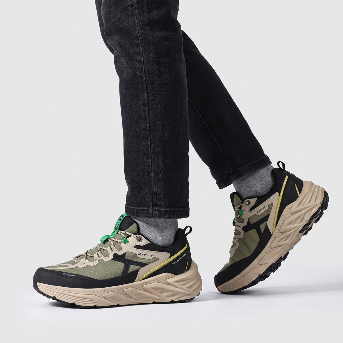 Terrabound Men's Trail Shoes in Olive worn mid-stride, side view from the knee down
