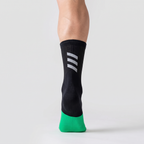 Cycling sock seen from behind, showing the mid-crew height and the reflective bars above the heel