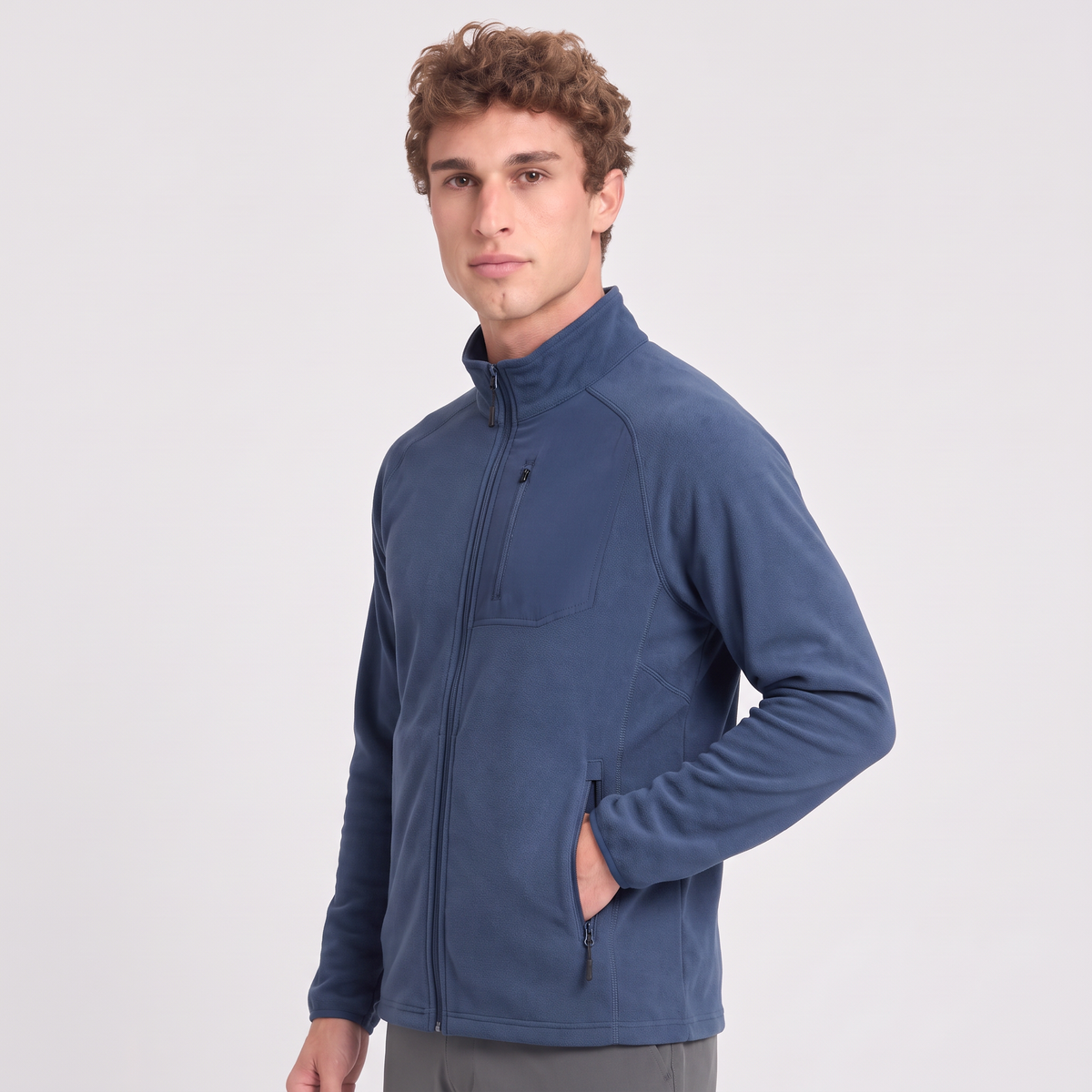 Terrabound Men's Fleece Jacket in Navy, three-quarter view with a hand in the zipped pocket