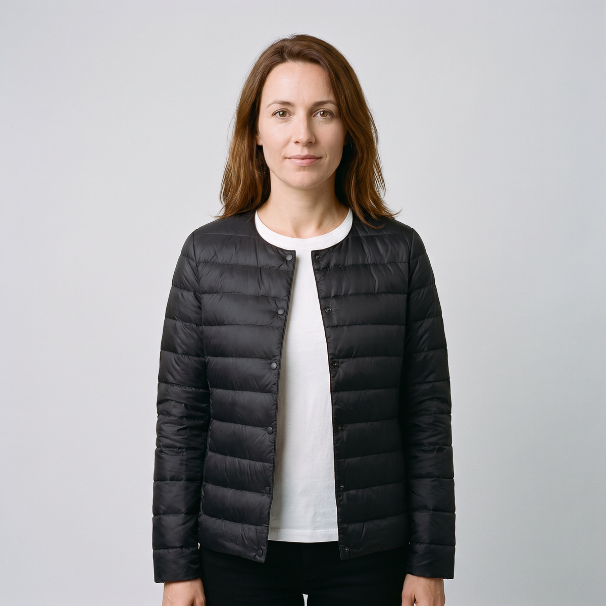Women's Puffer Jacket in Black, worn closed alone