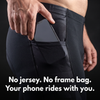 Hand sliding a phone into the open hip pocket of the cycling shorts