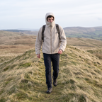 Walking an exposed ridge with the collar up and the hood down over it