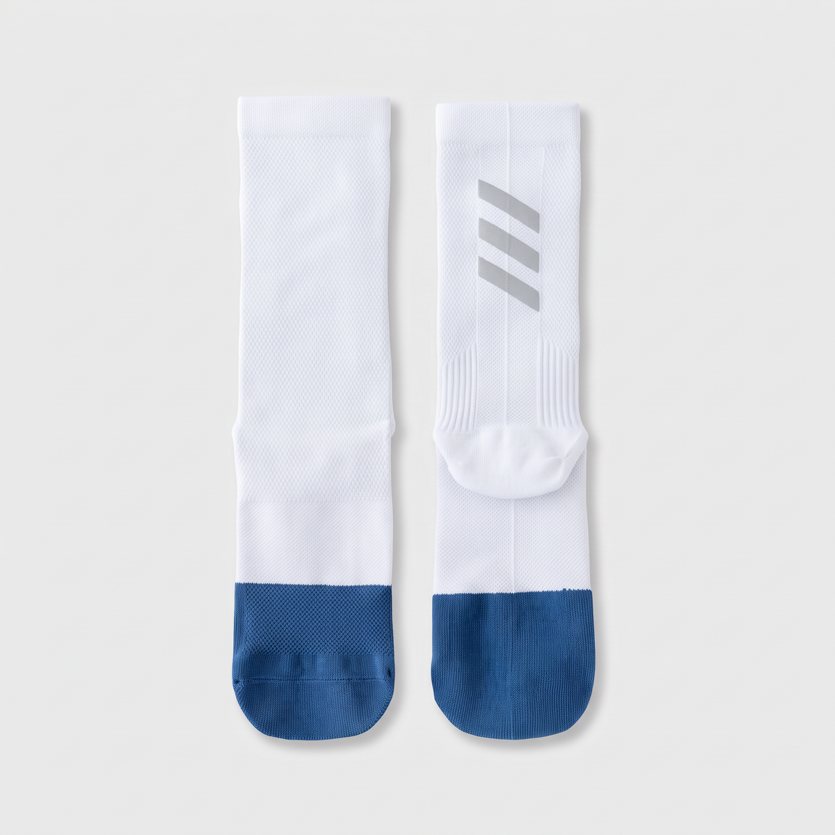 Cycling socks in Reflective White, white leg with a navy foot