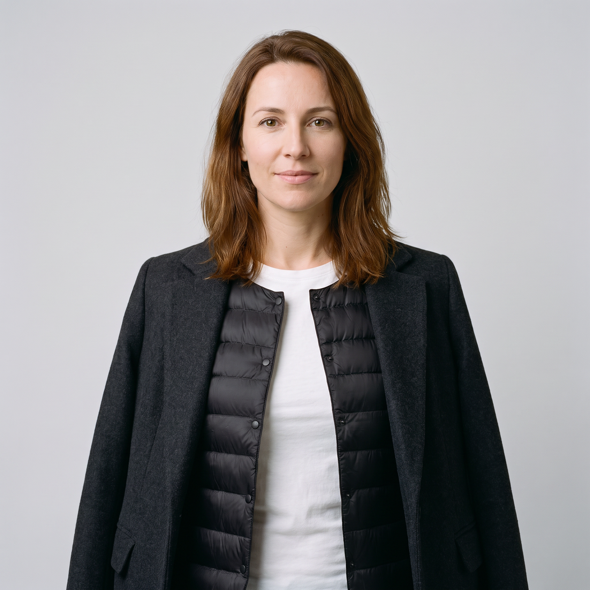 Women's Puffer Jacket in Black, layered open under a coat