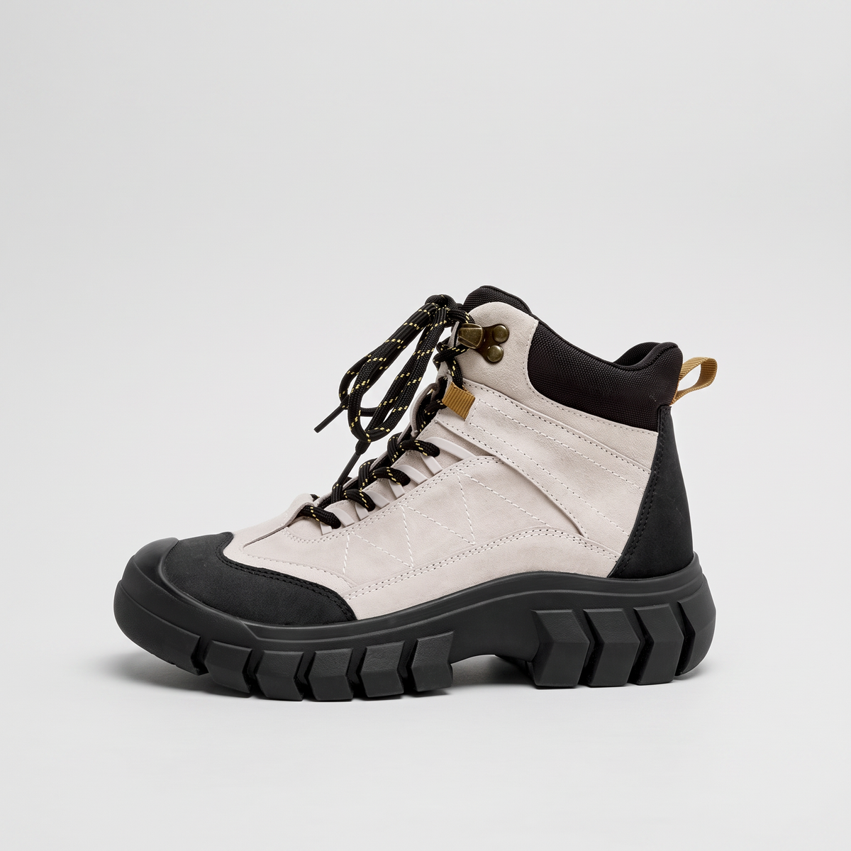 Terrabound Women's Walking Boots in Cream, angled view showing laces and lug sole