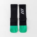 Cycling socks, pair laid flat, showing the reflective bars on each cuff