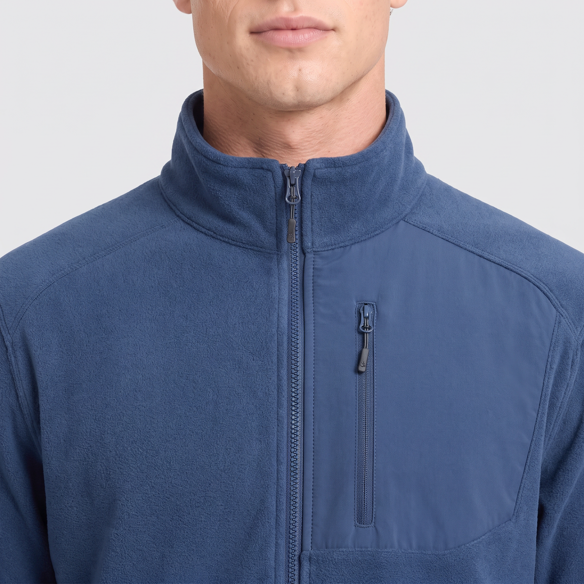 Close-up of the stand collar, zip and chest pocket on the Terrabound Men's Fleece Jacket in Navy