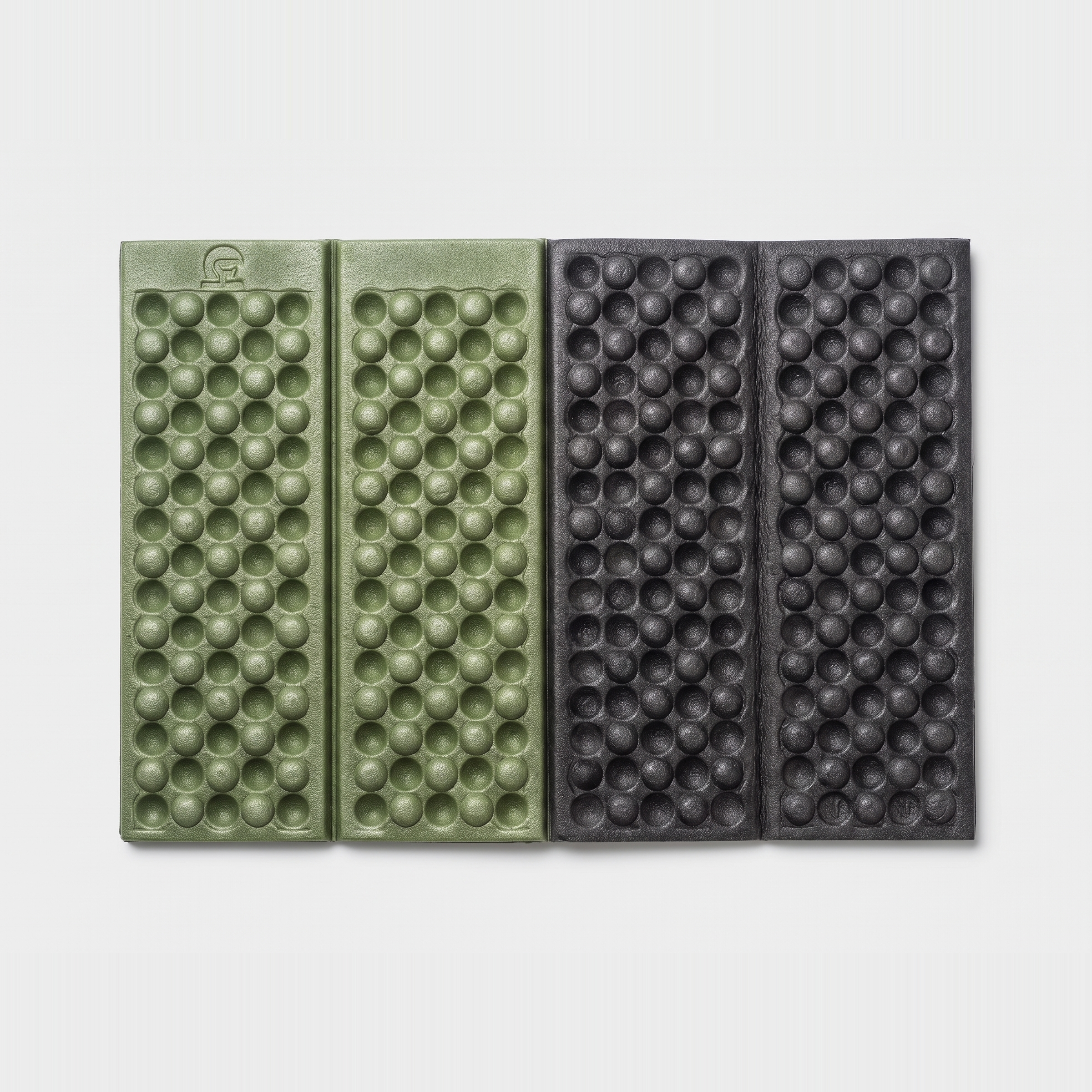 Folding sit mat folded in half showing the army green face and the black grey reverse face