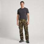 Man wearing Olive Green camo cargo trousers with a charcoal T-shirt and trail shoes