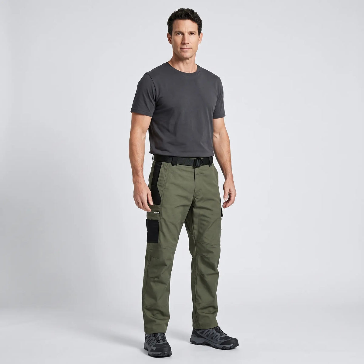 Man wearing Army Green ripstop cargo trousers with a charcoal T-shirt and trail shoes