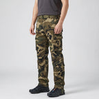 Olive Green camo cargo trousers worn, side view with thigh and lower-leg cargo pockets