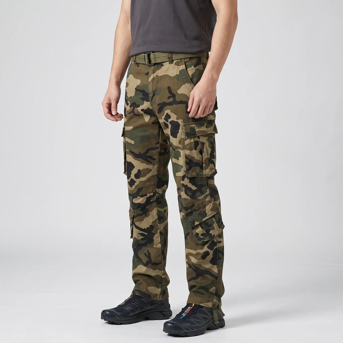 Olive Green camo cargo trousers worn, side view with thigh and lower-leg cargo pockets
