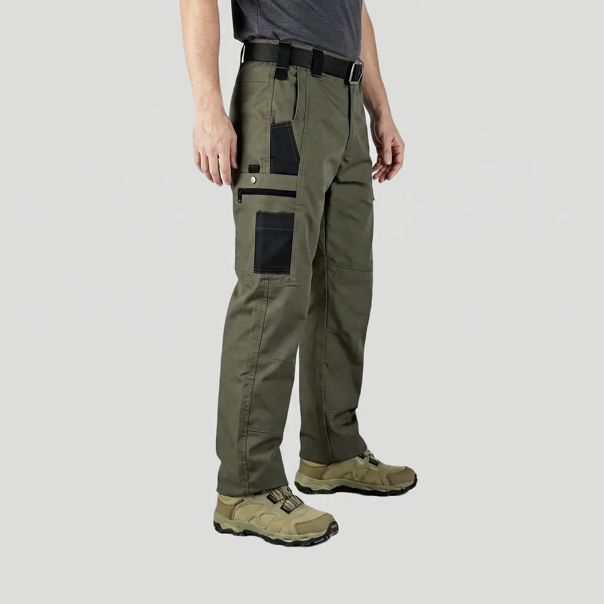Army Green work trousers worn, side view with zip thigh pocket and phone pocket