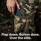 Hand sliding a phone into the thigh cargo pocket