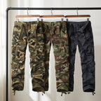 Camo cargo trousers in Olive Green, Army Green and Blue on a rail