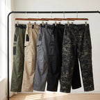 Work trousers in Army Green, Khaki, Grey, Black and Black Camo on a rail