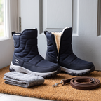 Navy snow boots on a doormat with wool socks and a dog lead