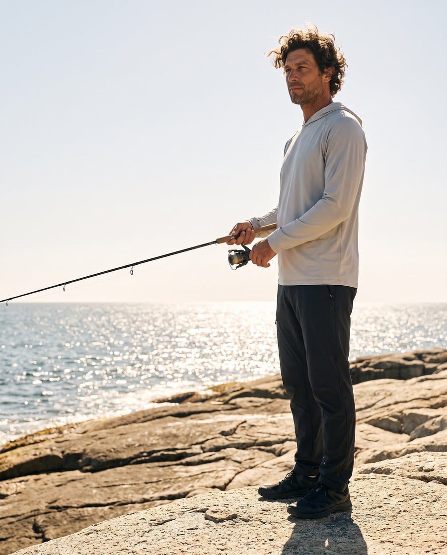 Fishing from the rocks in the grey sun hoodie