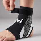 Hand wrapping the hook-and-loop strap of the ankle support brace round the ankle