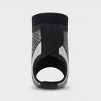 Back view of the ankle brace showing the open heel and strap fastening