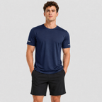 Man wearing the men's running top in Navy, front view