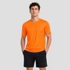 Man wearing the men's running top in Orange, front view