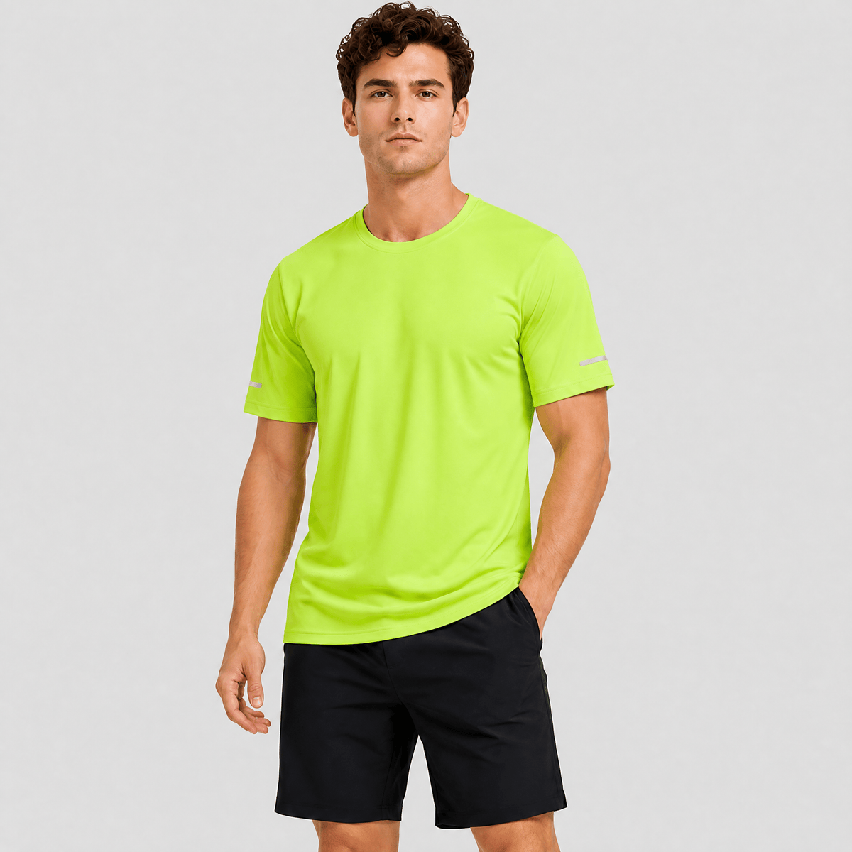 Man wearing the men's running top in Lime Green, front view