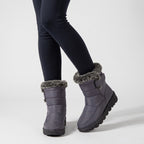 Grey fur lined winter boots worn with leggings