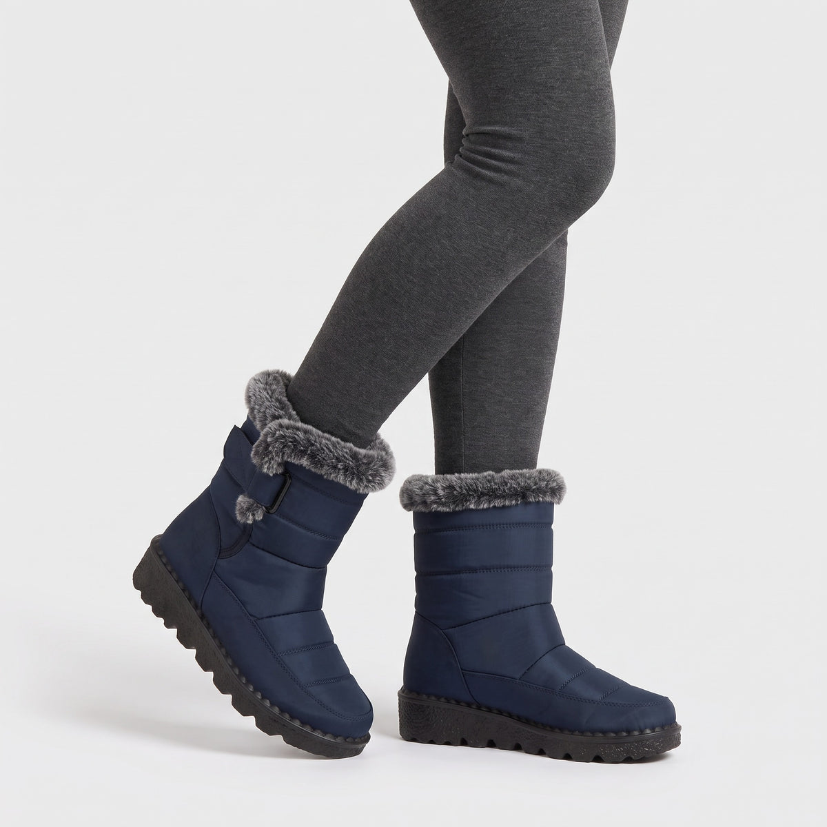 Blue fur lined winter boots worn with leggings