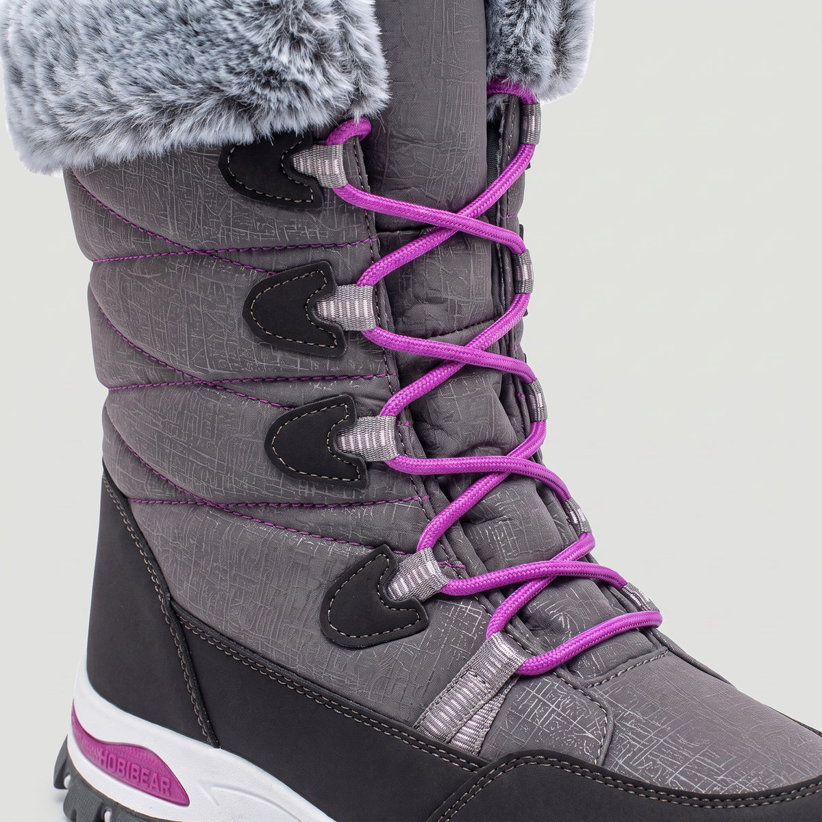 Close-up of the laces running through fabric loops on the Grey mid calf snow boots