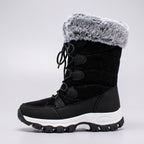 Side profile of the Black mid calf snow boot showing shaft height and faux fur cuff