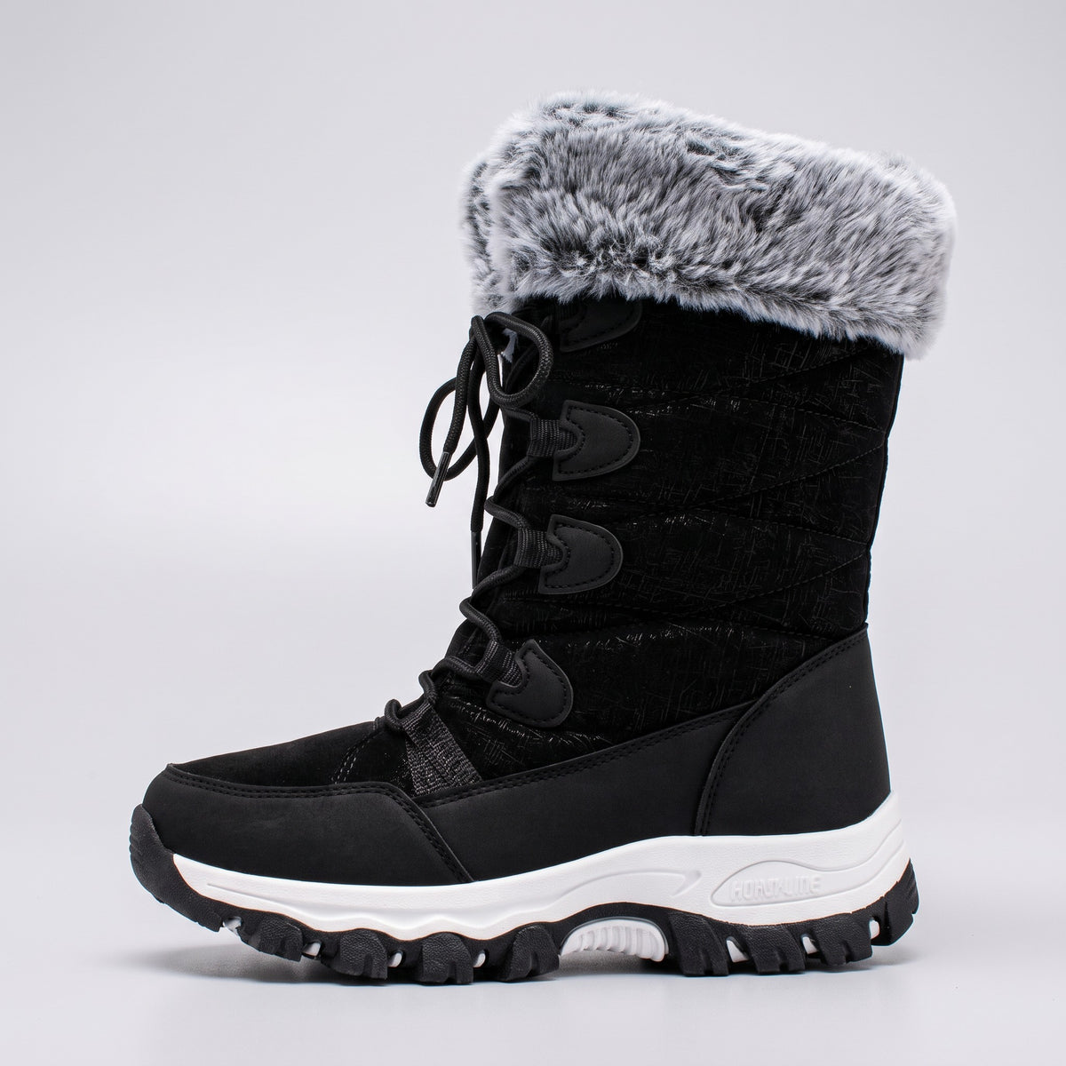 Side profile of the Black mid calf snow boot showing shaft height and faux fur cuff