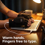 Hands typing on a laptop in USB heated fingerless gloves, fingers free to type