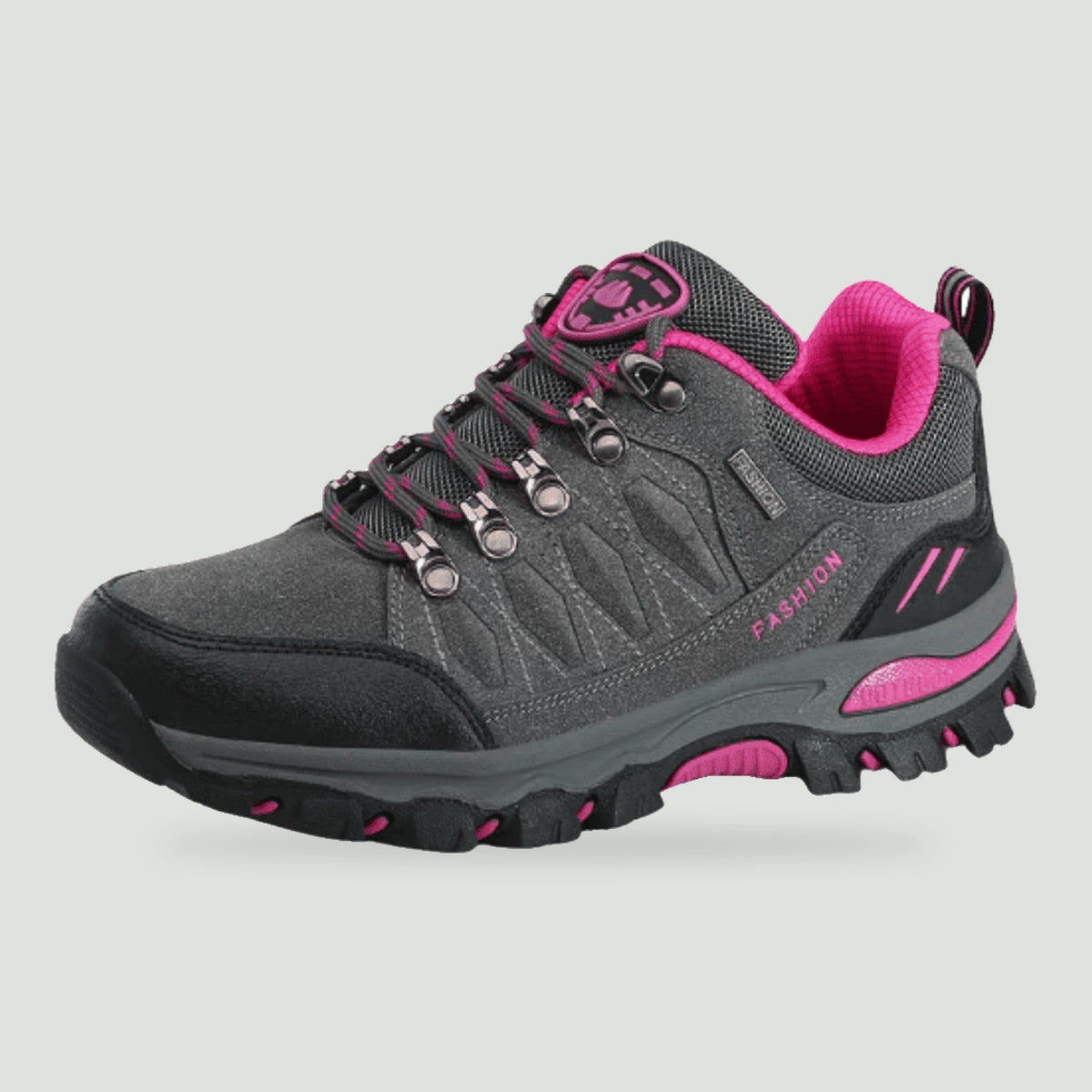 Women's hiking shoe in Grey with pink accents, side view