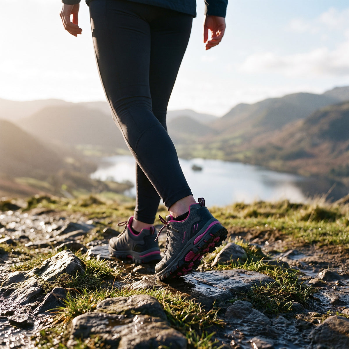 Woman walking a rocky Lake District hill path in the Grey women's hiking shoes