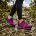 Women's hiking shoes in Pink worn on a trail