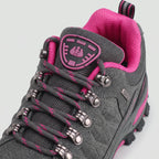 Close-up of the metal lace hooks, padded tongue badge and collar on the Grey hiking shoes