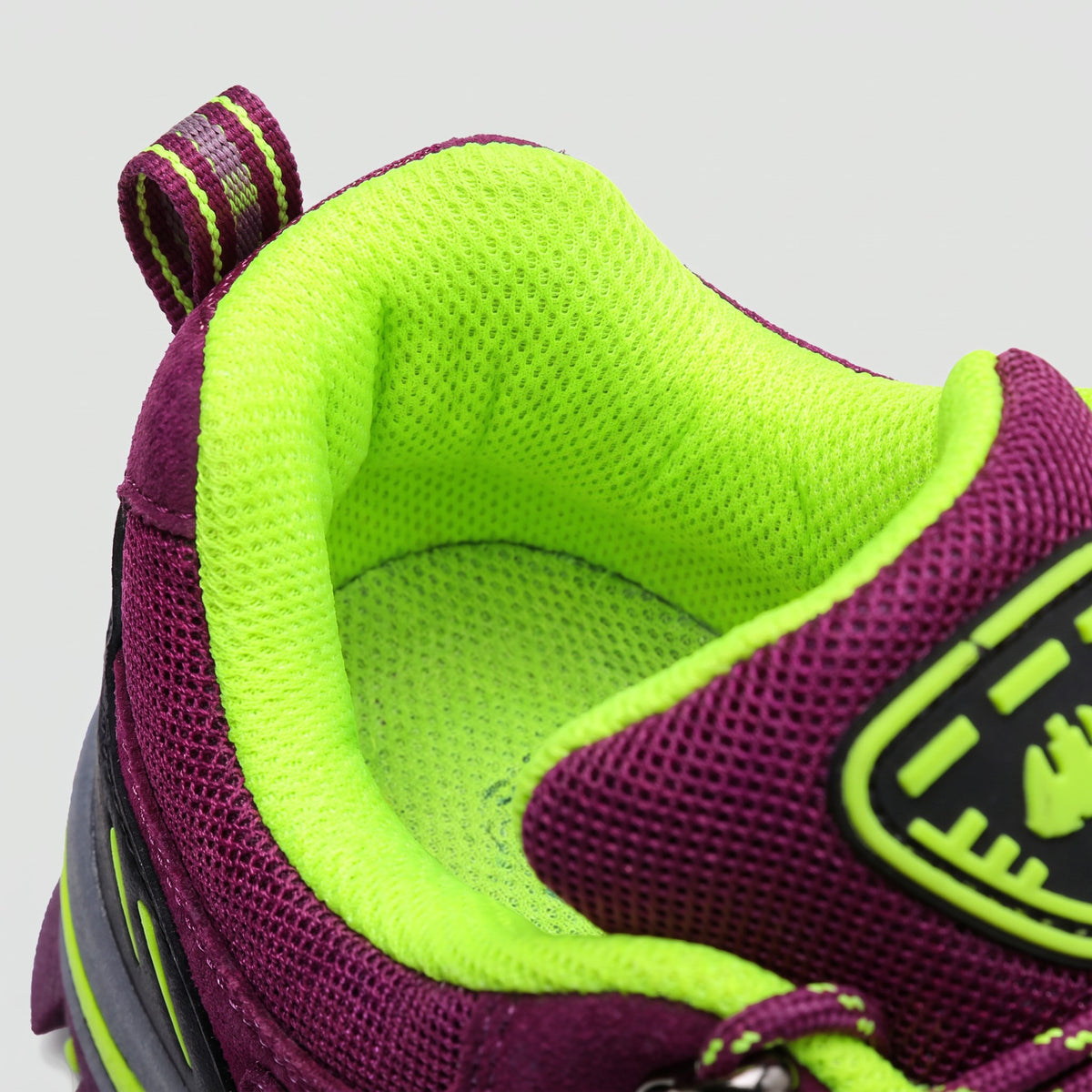 Padded collar, cushioned lining and heel pull loop of the Purple walking shoes